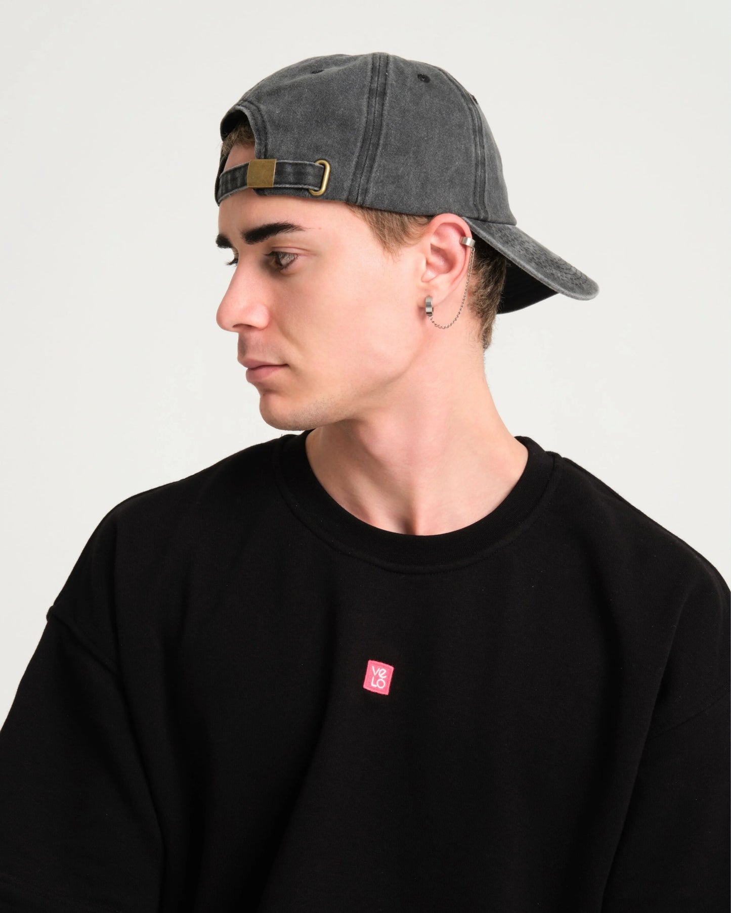 man wearing back side of Dark Gray Washed Cap with Love You Bye embroidered in white