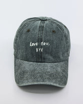 Dark Green Washed Cap with 'Love You, Bye' embroidered in white.