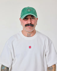 man wearing Green Love Myself Washed Cap