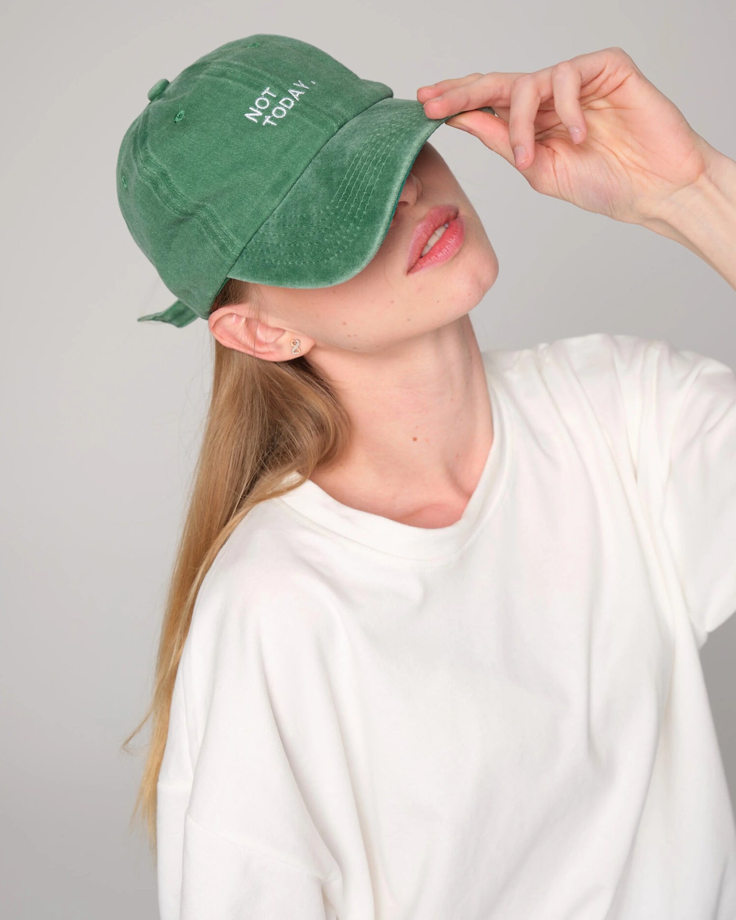 side view of woman wearing Not Today Green Washed Cap