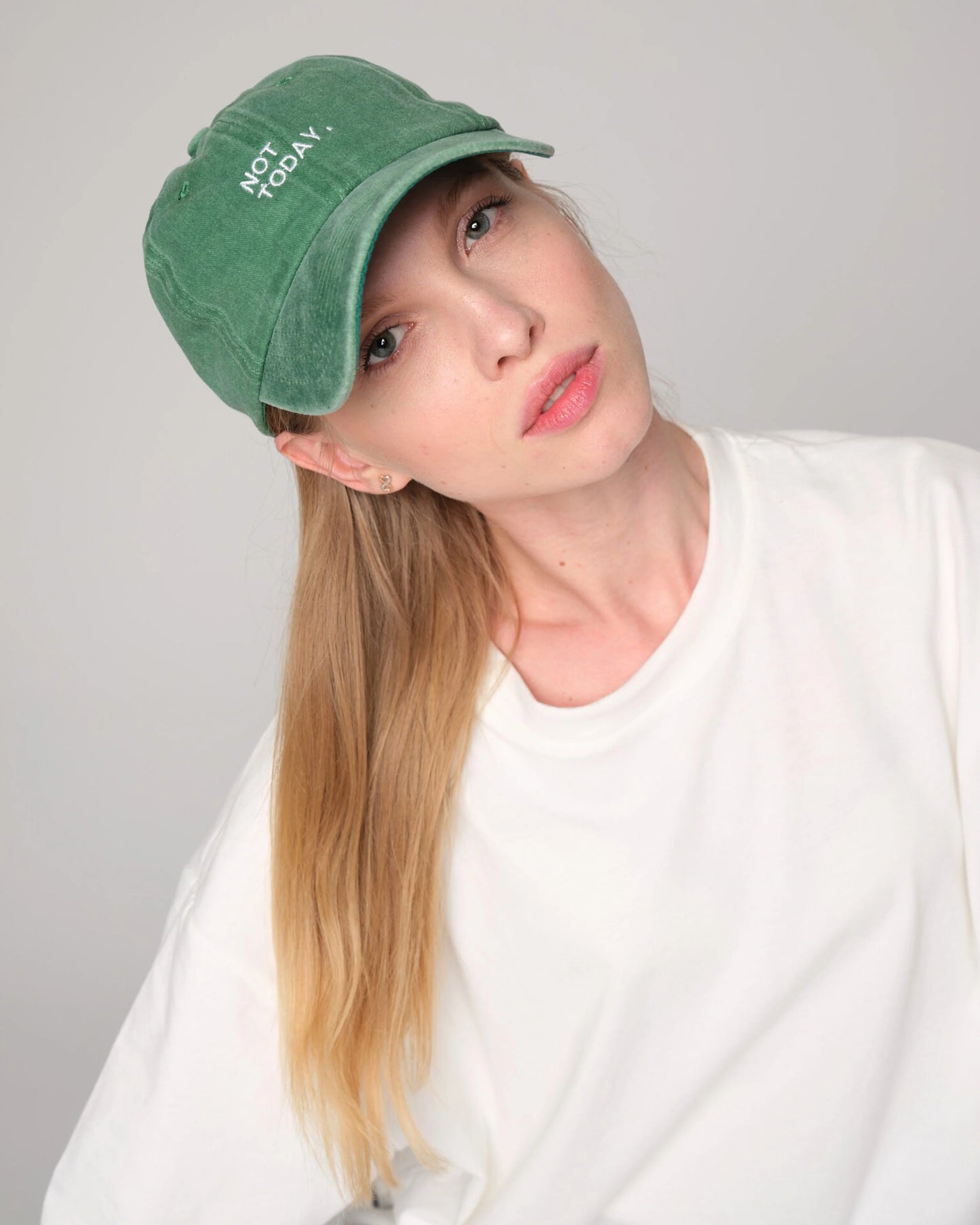 woman wearing Not Today Green Washed Cap