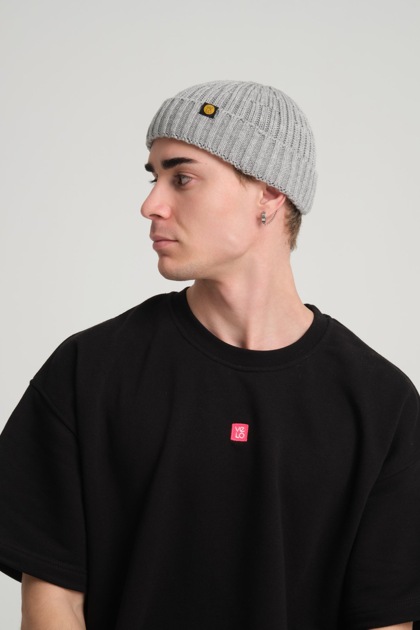 side view of a man wearing Grey Fisherman Beanie