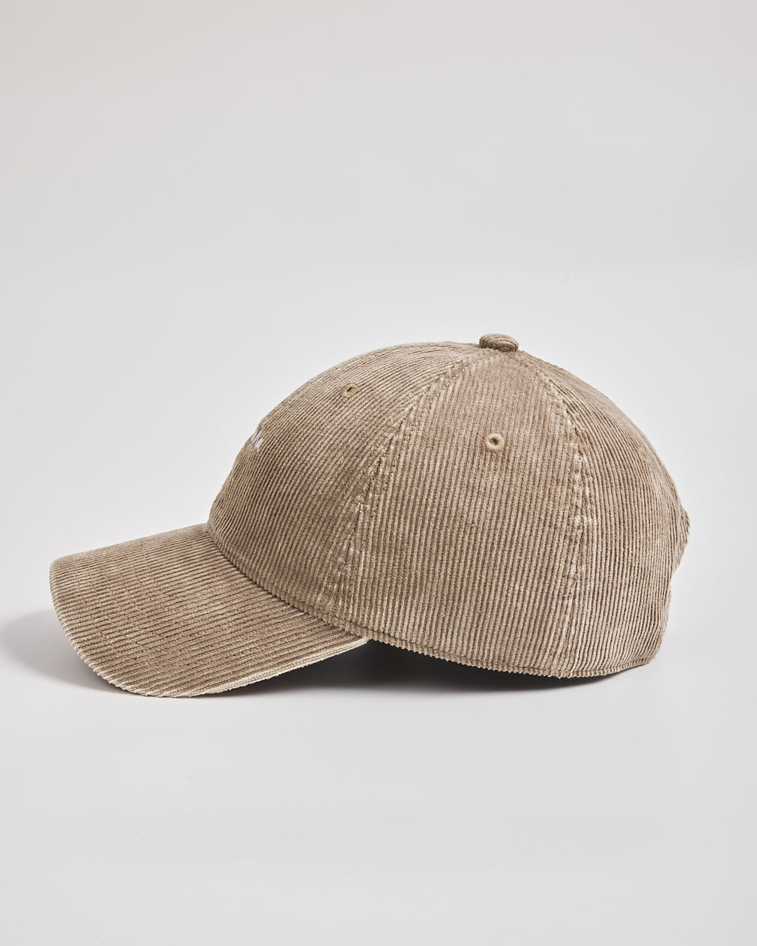 Beige corduroy cap on a light gray background