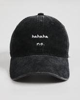 Black corduroy cap with 'hahaha no.' text on a white background