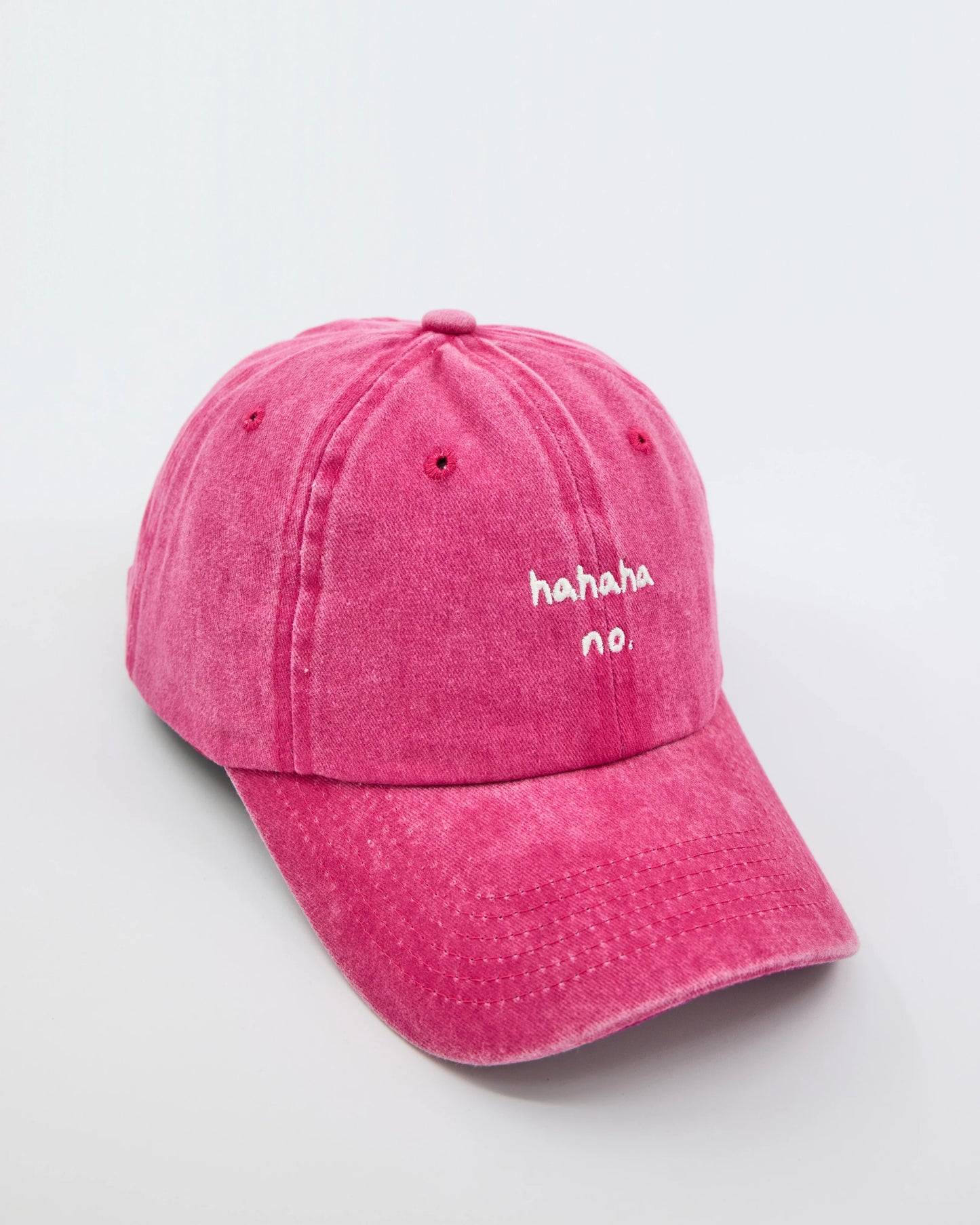 side view of Hahaha No Hot Pink Washed Cap
