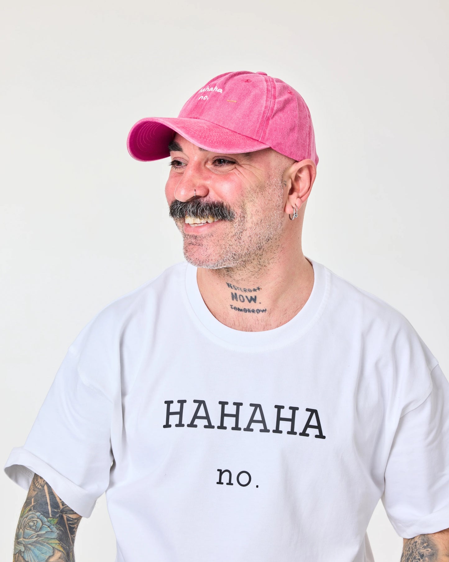 man wearing Hahaha No Hot Pink Washed Cap Hat