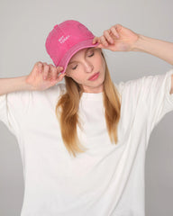 woman holding Hot Pink Washed Cap with Not Today embroidered in white