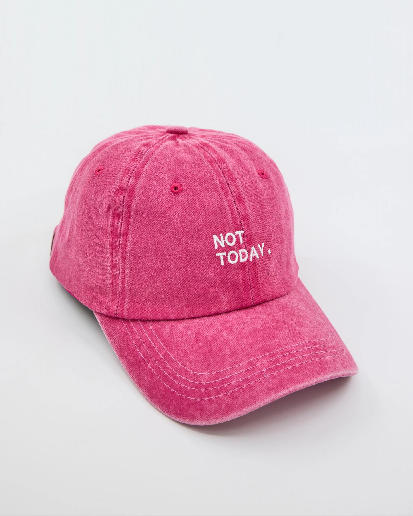 side view of Hot Pink Washed Cap with Not Today embroidered in white
