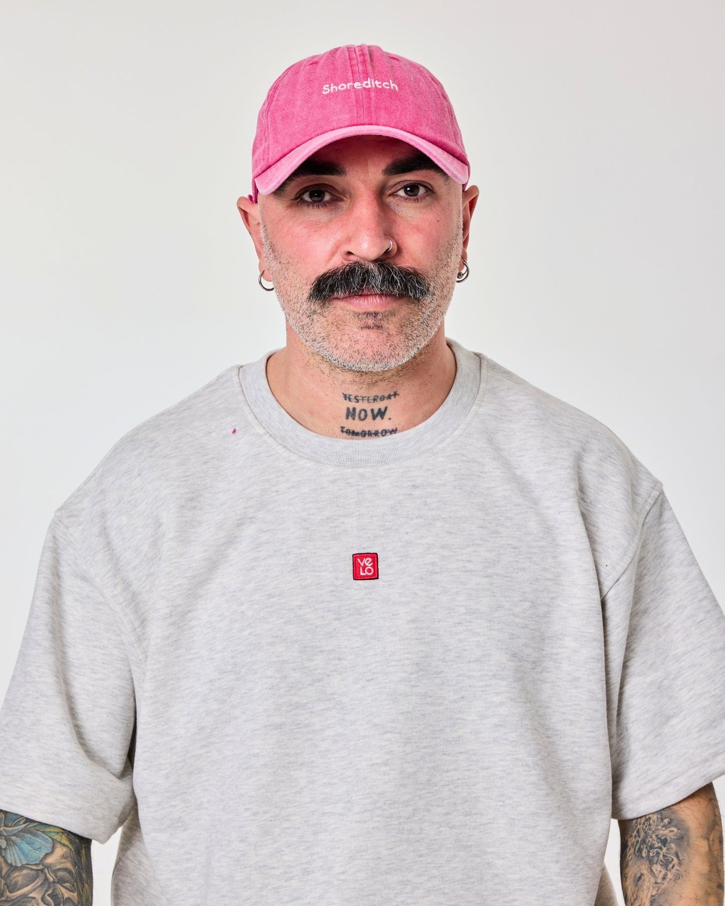 front view of a man wearing Shoreditch Hot Pink Washed Cap