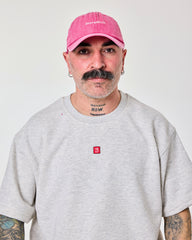 front view of a man wearing Shoreditch Hot Pink Washed Cap