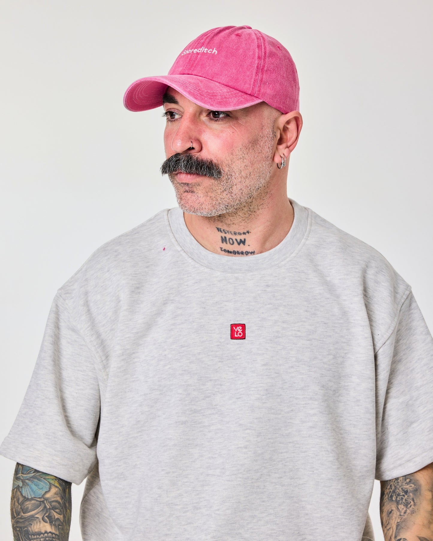 side view of a man wearing Shoreditch Hot Pink Washed Cap