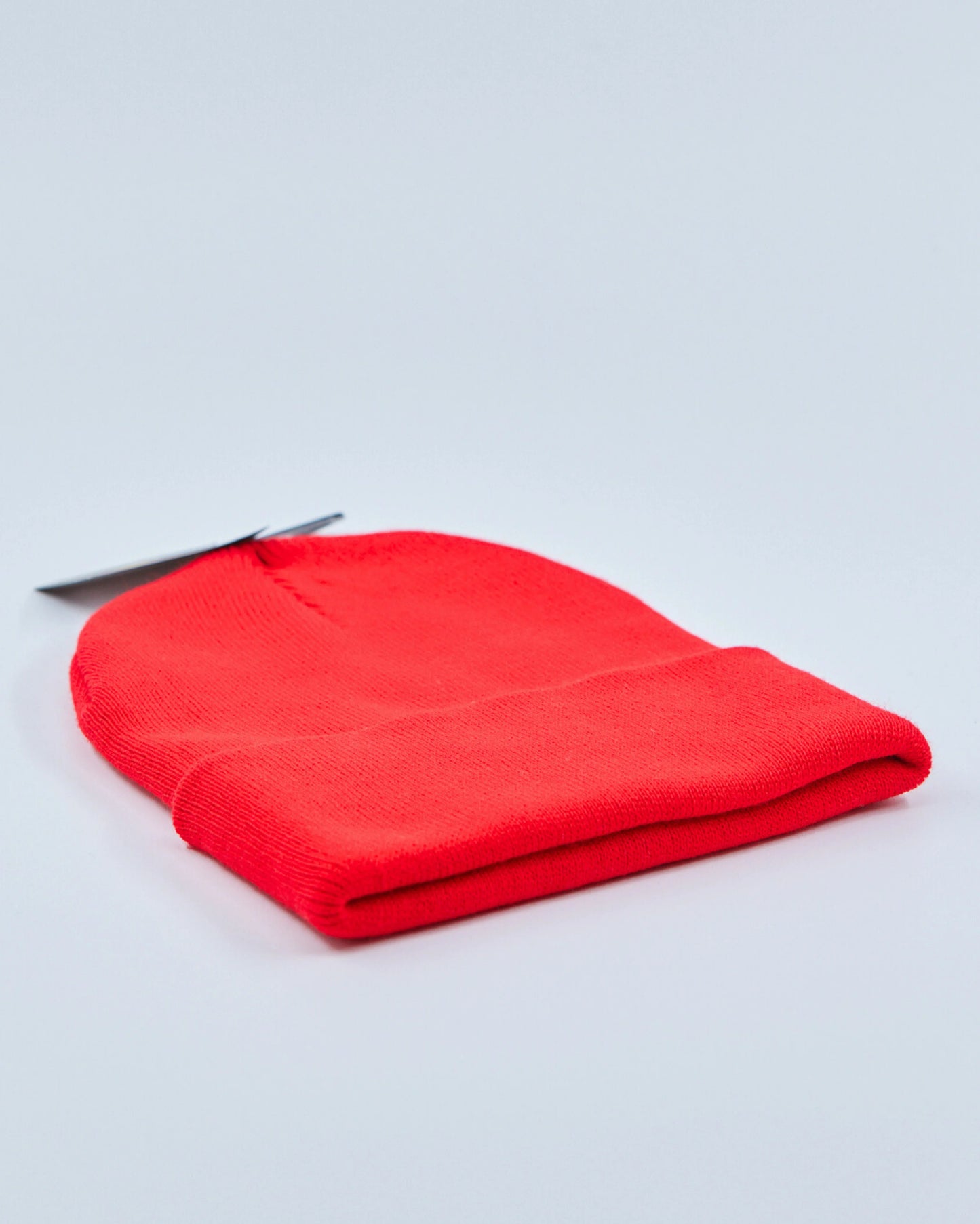 Red beanie on a light gray background