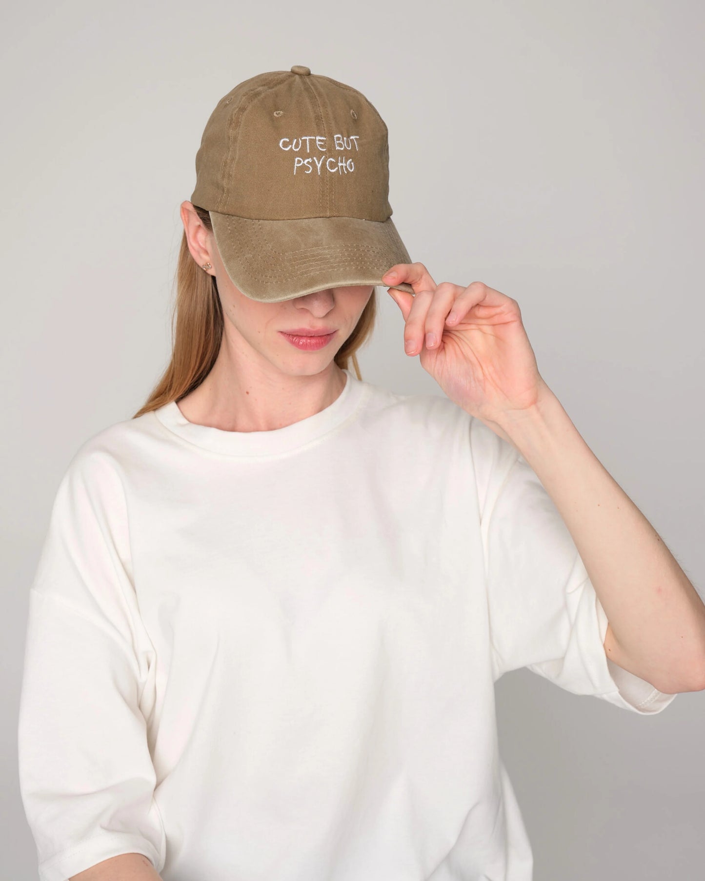 woman wearing Cute But Psycho Khaki Washed Cap