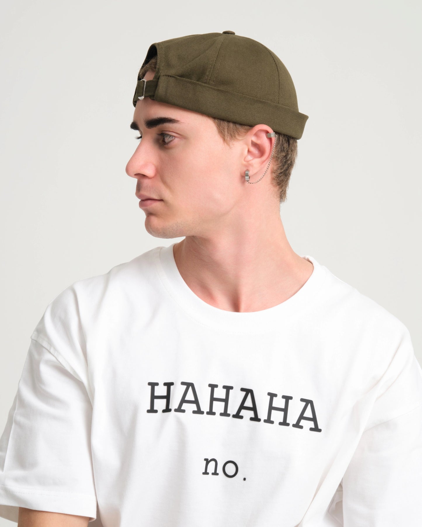 man wearing khaki docker hat