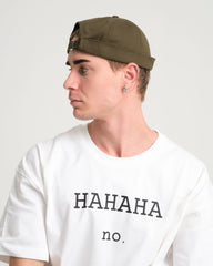 man wearing khaki docker hat