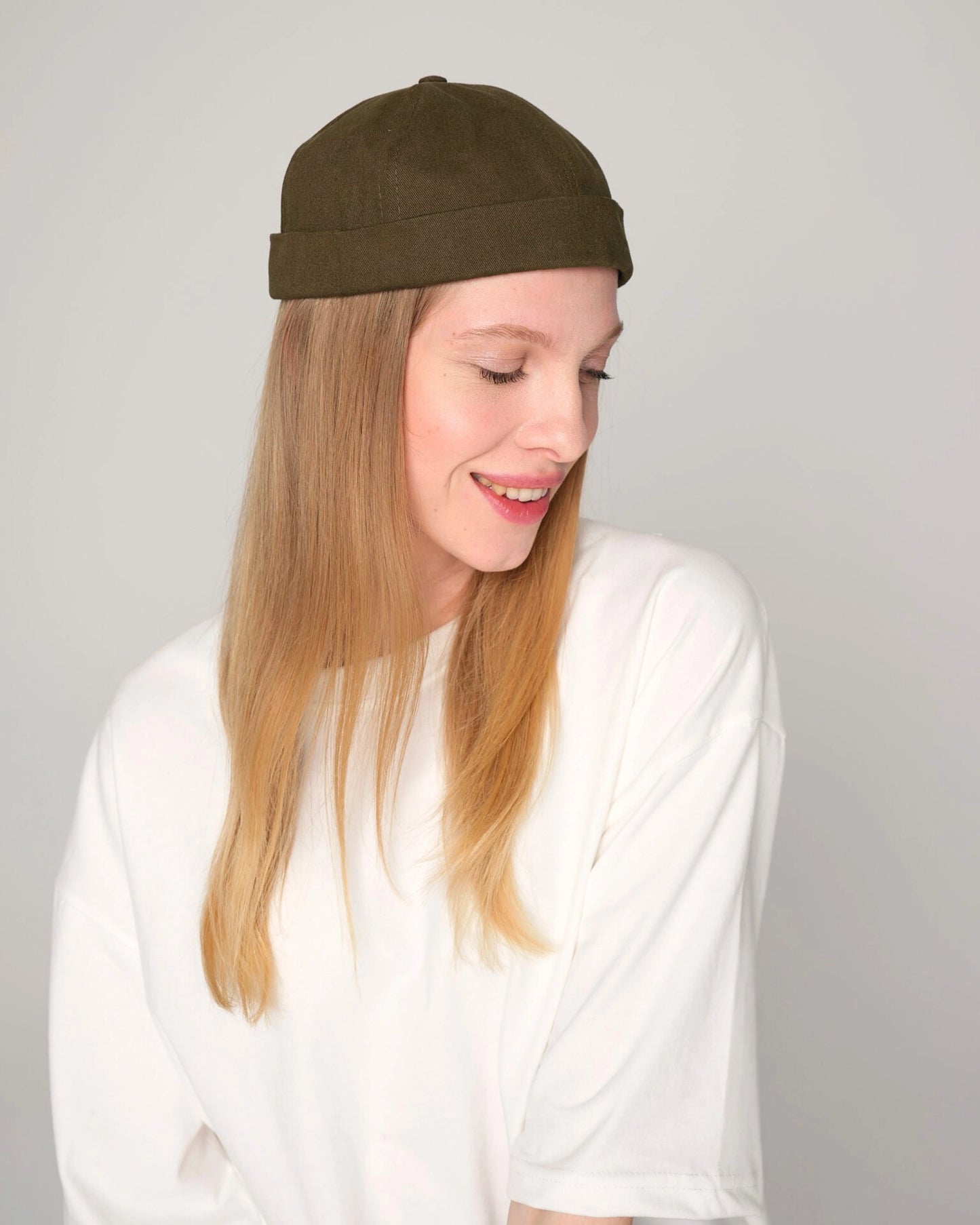 woman wearing khaki docker cap