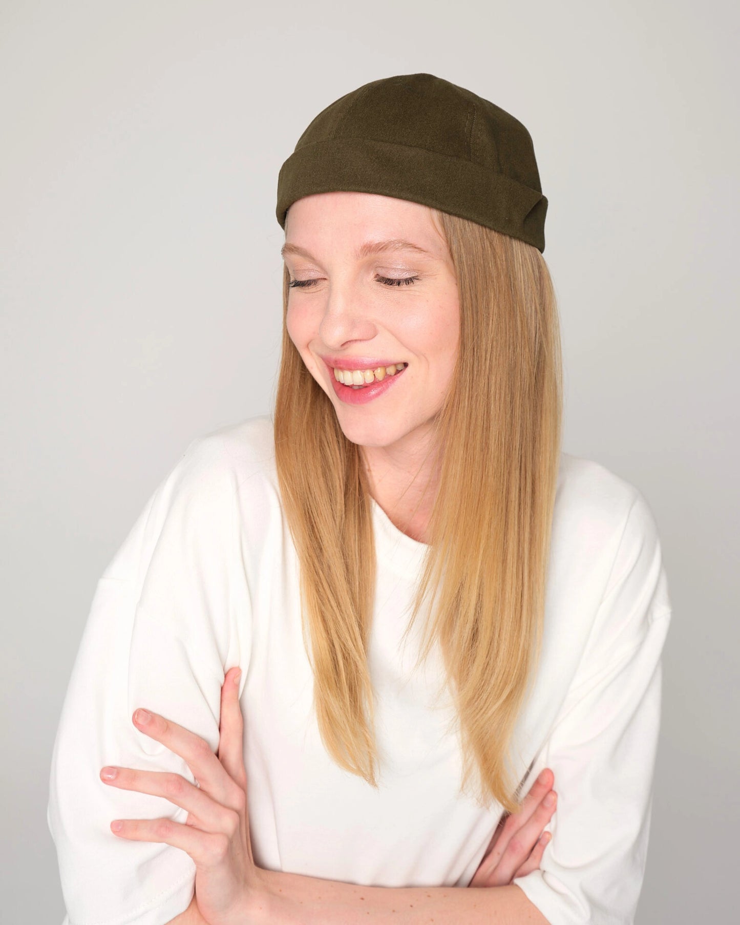 woman wearing khaki docker hat