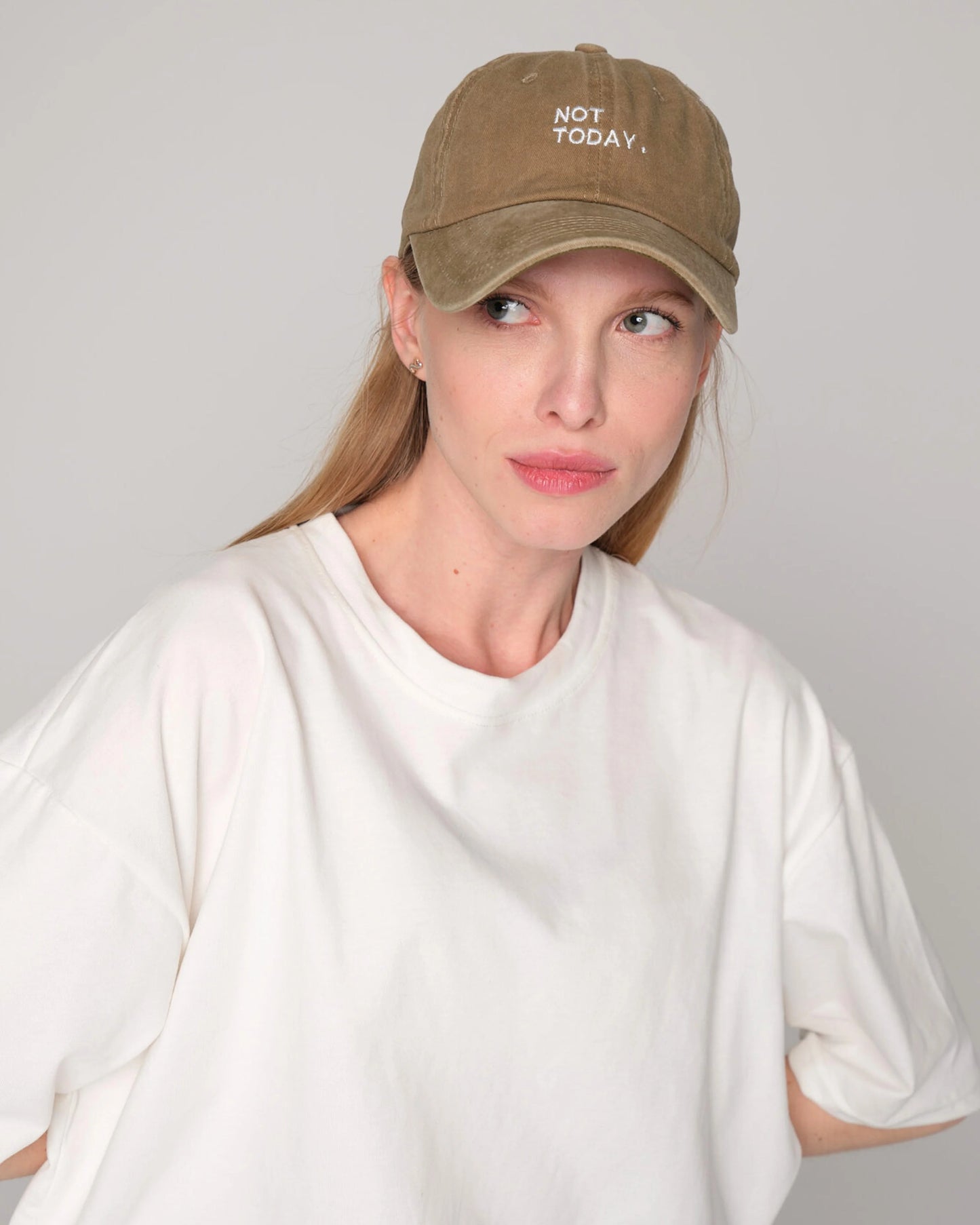 woman wearing Khaki Washed Cap with Not Today embroidered in white