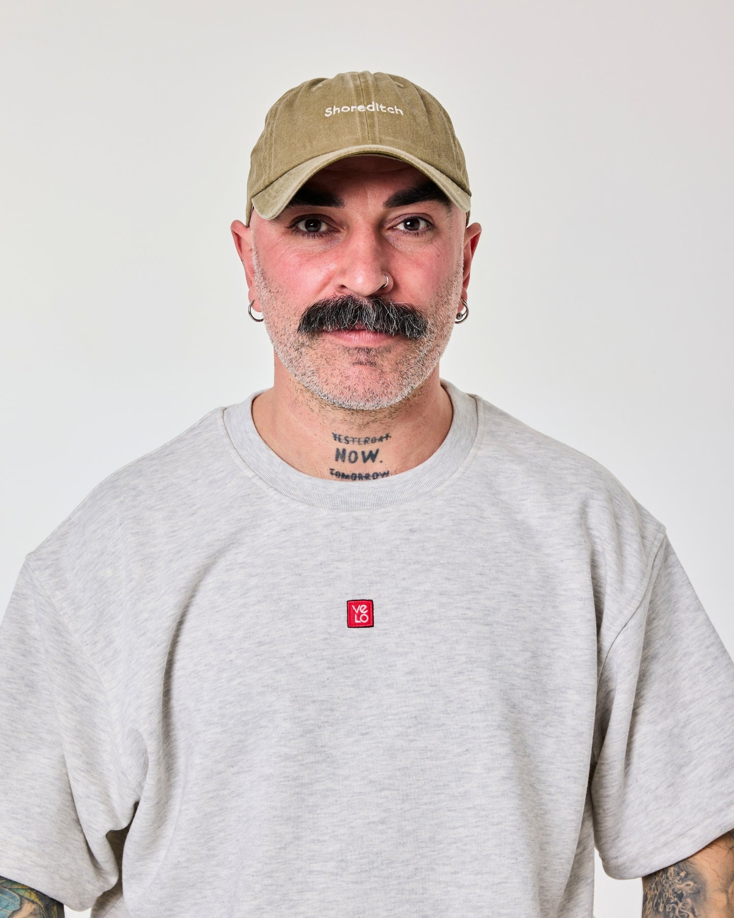 front view of man wearing Shoreditch Khaki Washed Cap