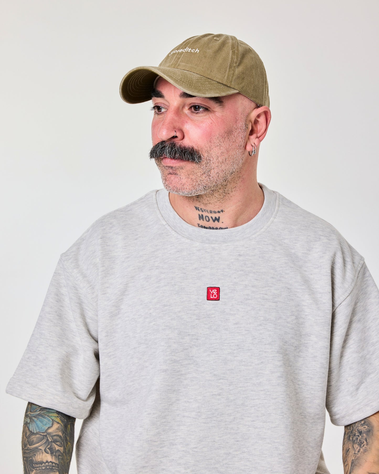 side view of man wearing Shoreditch Khaki Washed Cap