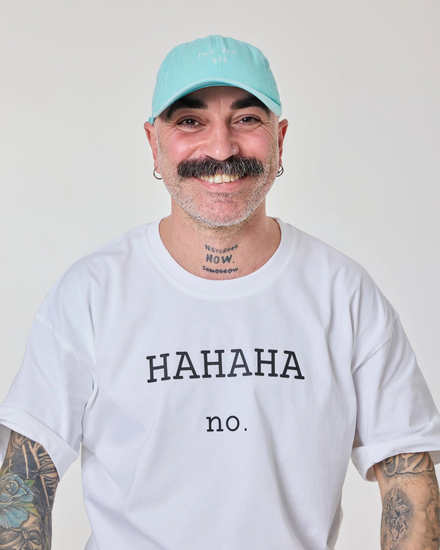 man wearing Light Blue Washed Cap with Love You Bye embroidered in white