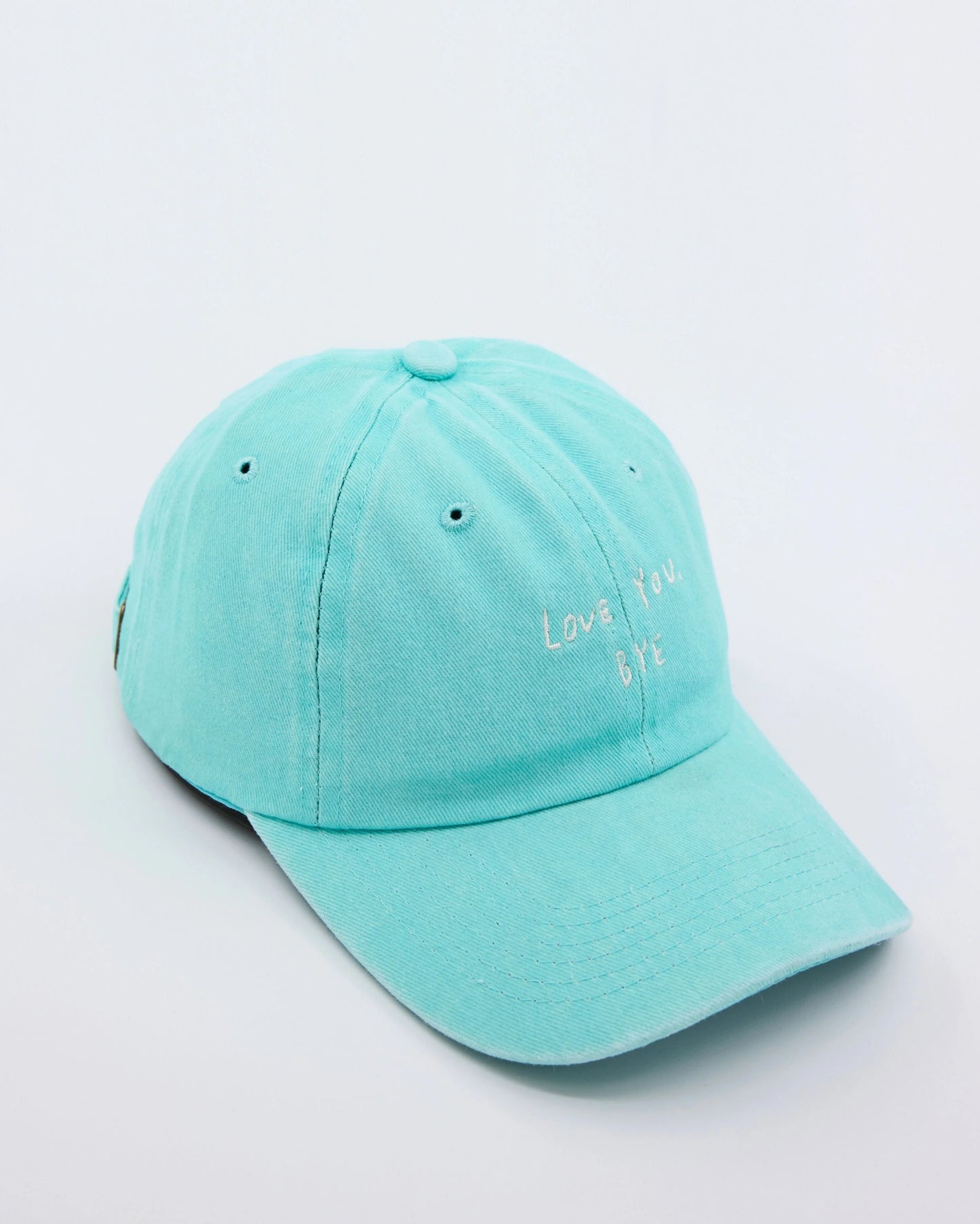 side view of Light Blue Washed Cap with Love You Bye embroidered in white