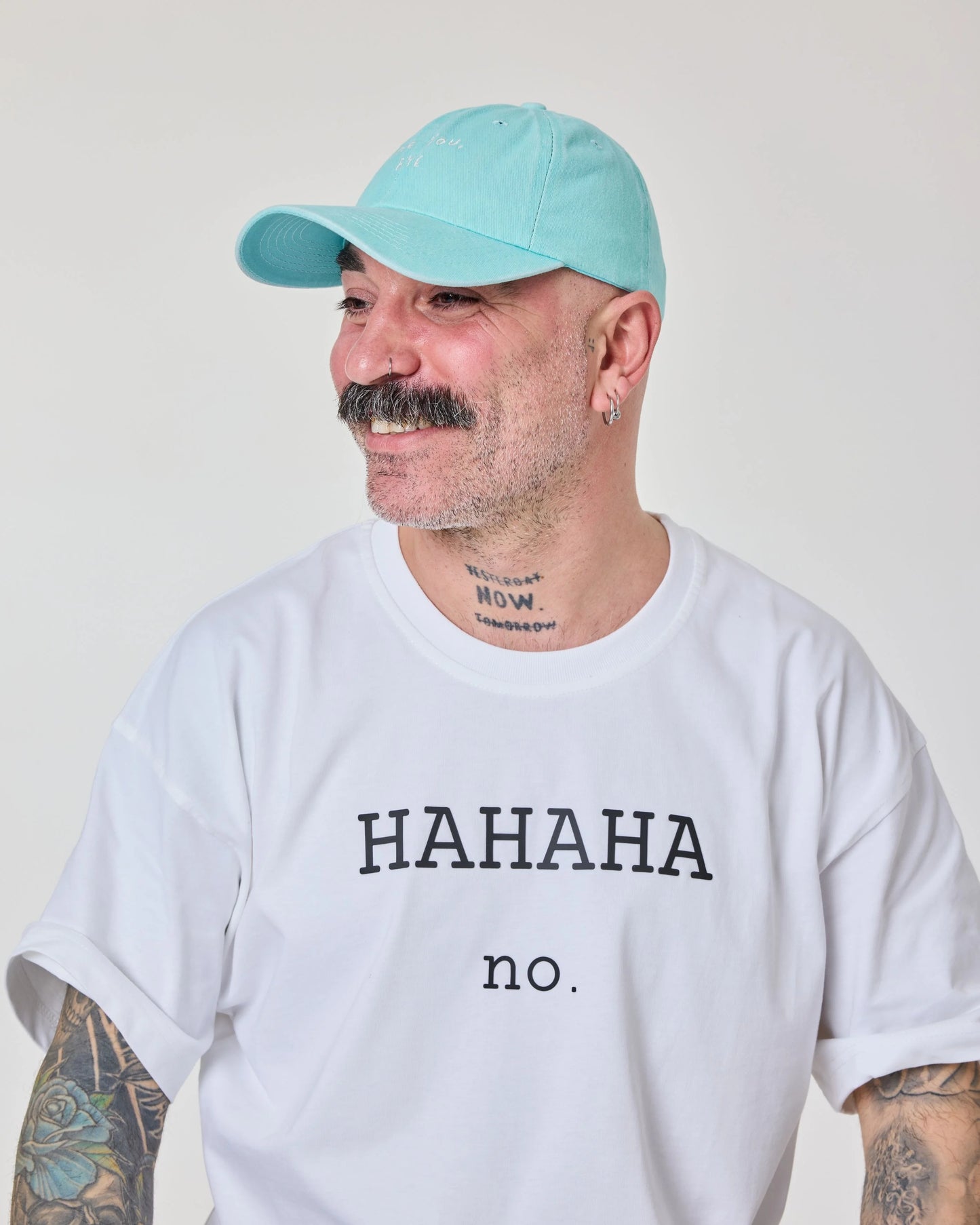 man wearing Light Blue Washed Cap with Love You Bye embroidered in white