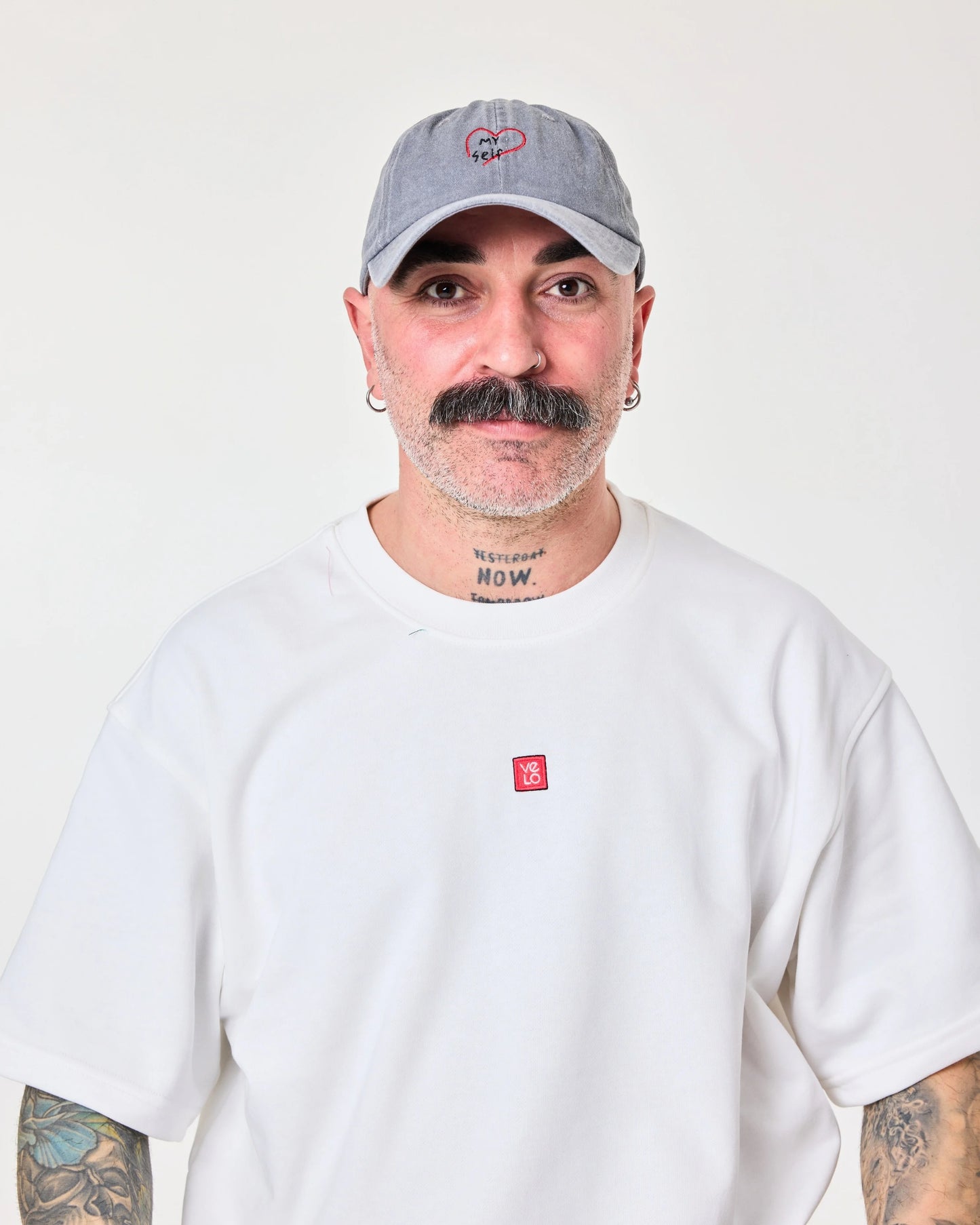 man wearing Light Gray Washed Cap with Love Myself embroidered in black