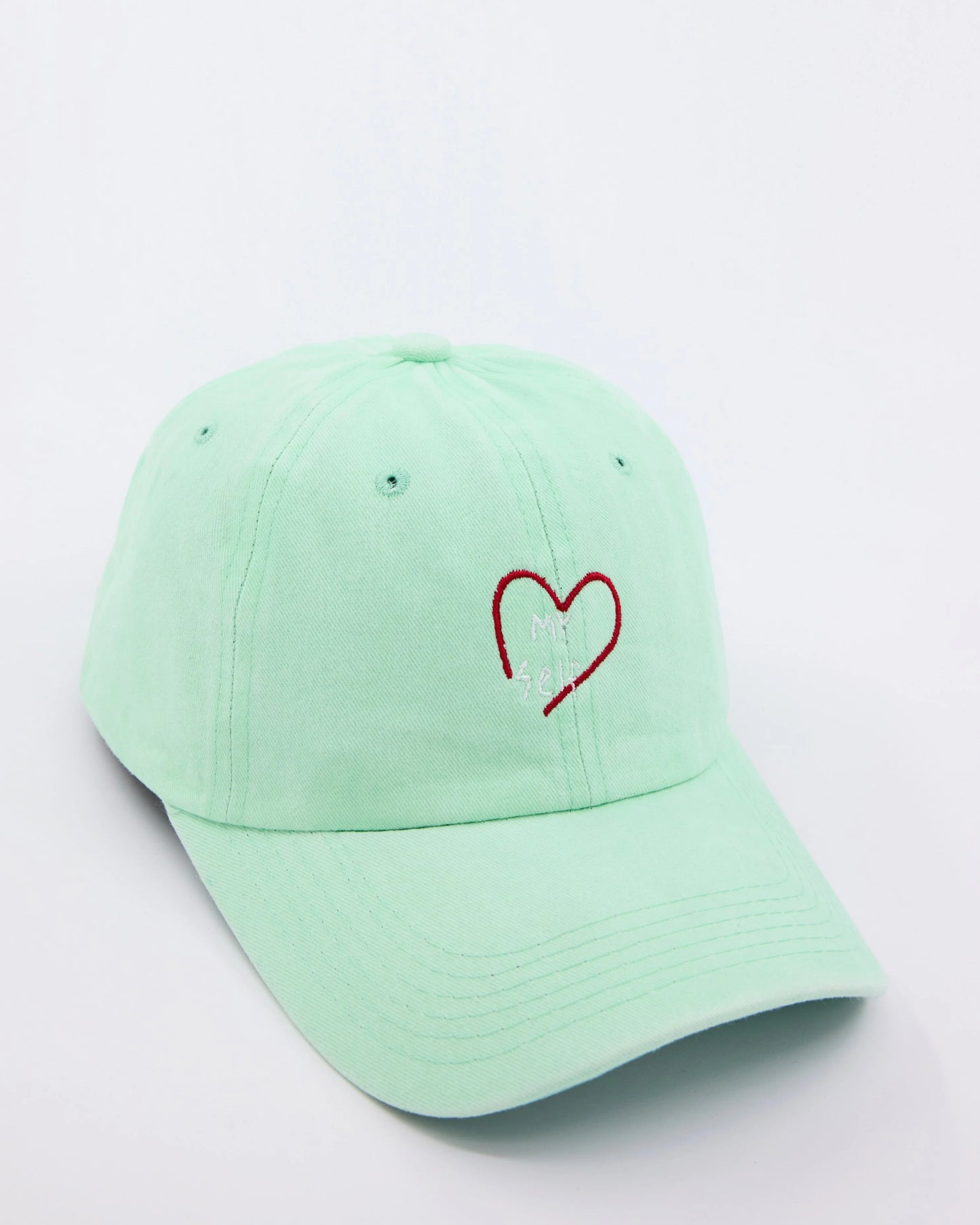 side view of Light Green Love Myself Washed Cap