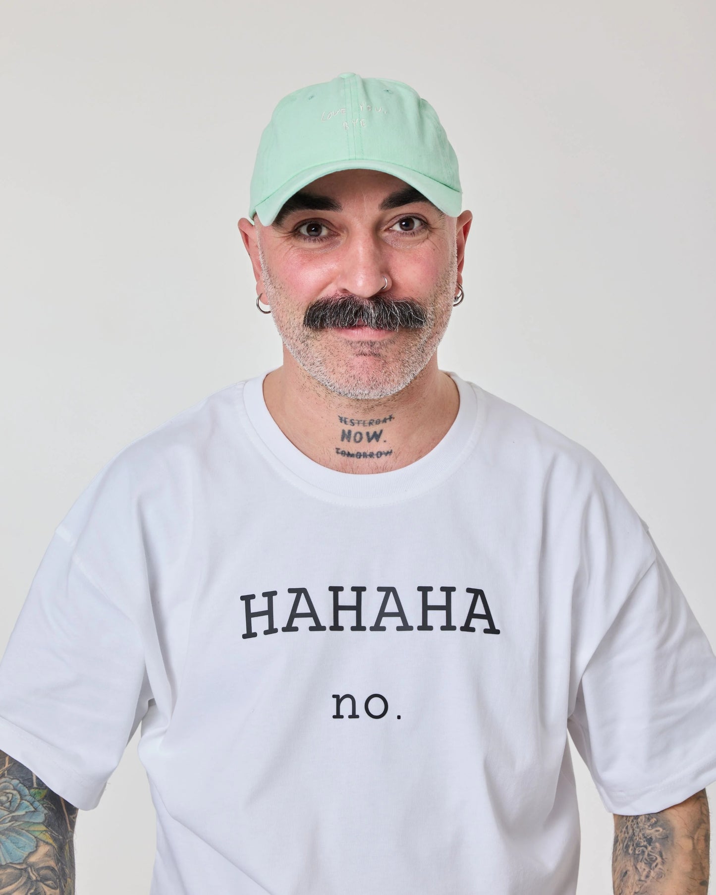 man wearing Light Green Washed Cap with Love You Bye embroidered in white