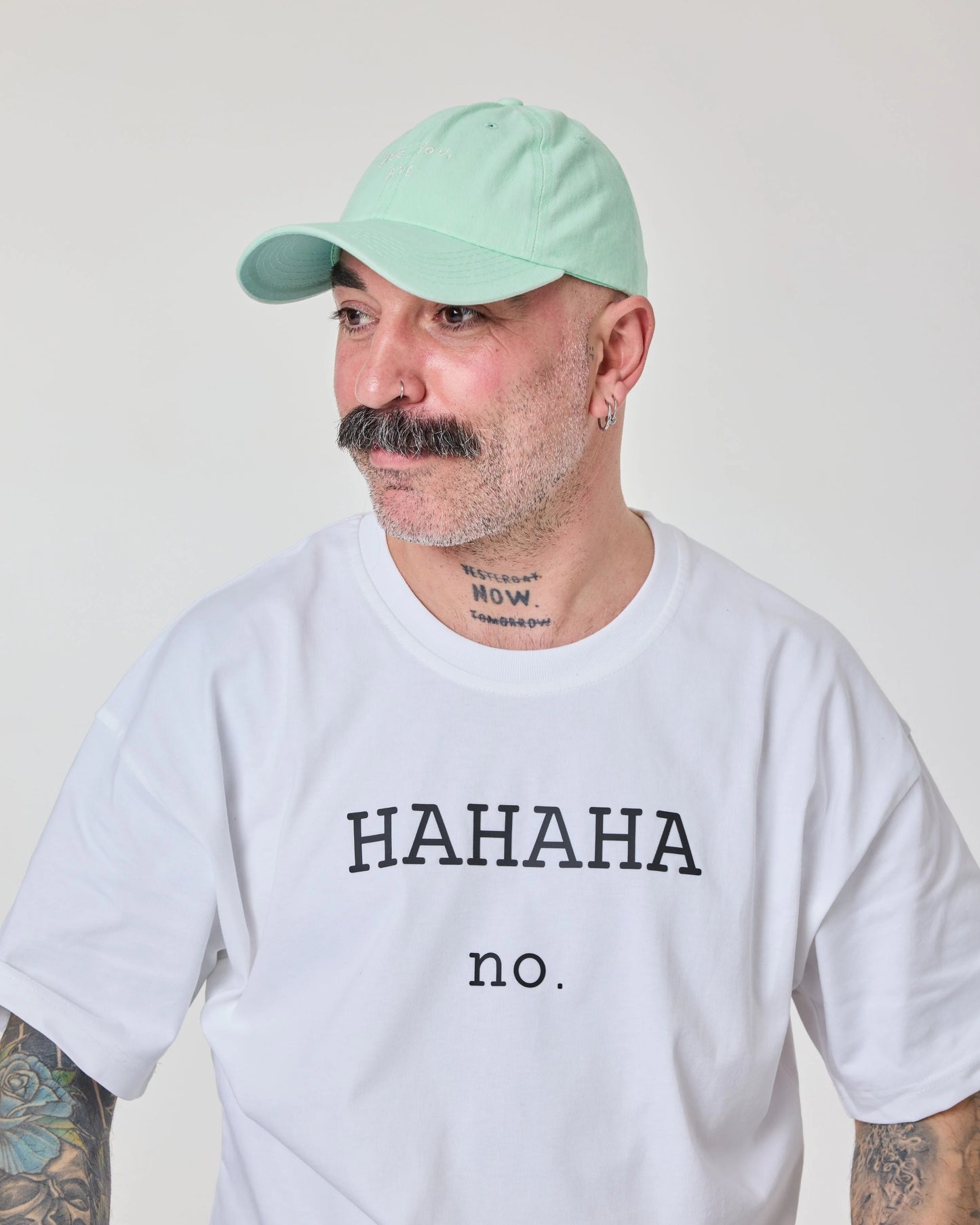 man wearing Light Green Washed Cap with Love You Bye embroidered in white