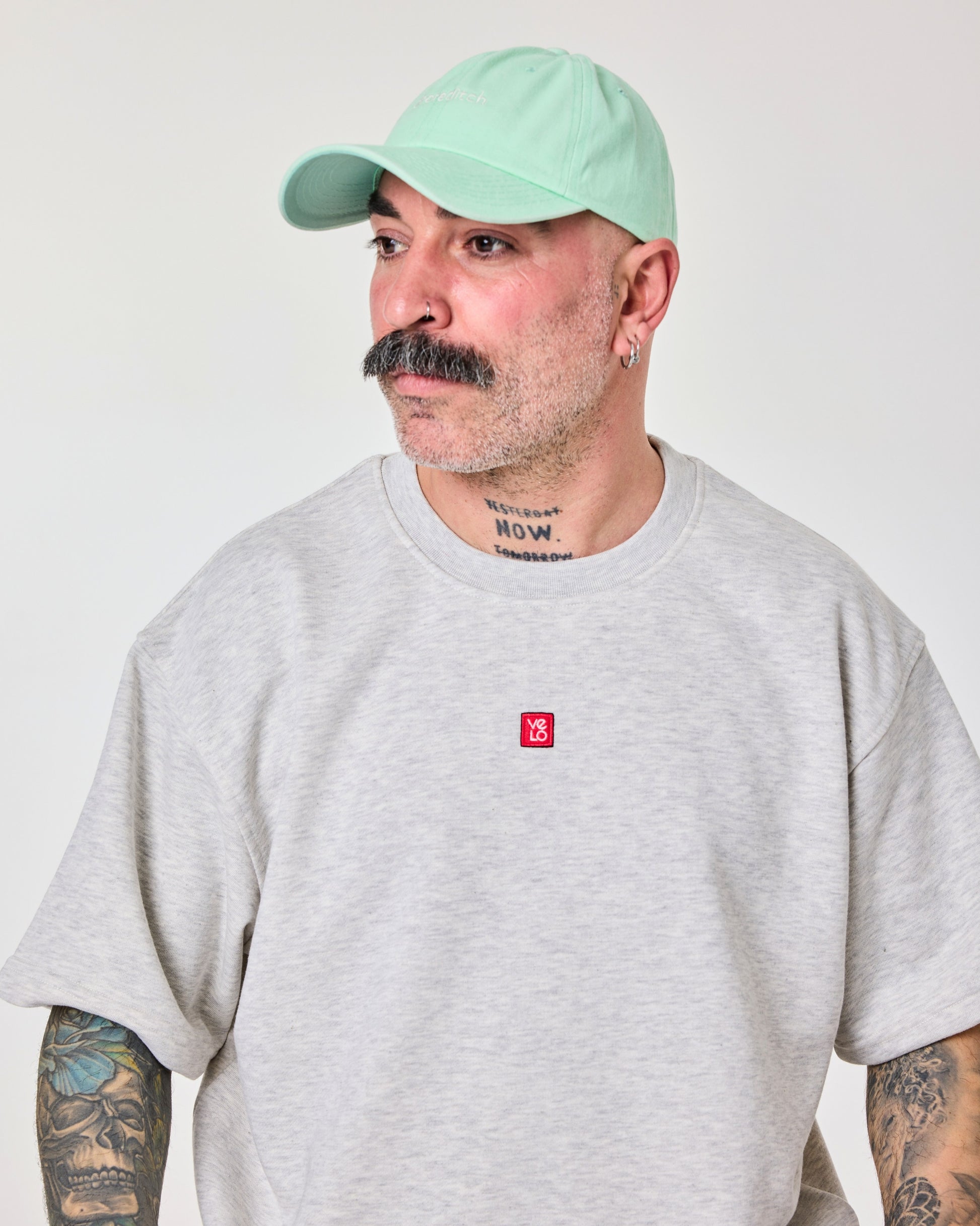 side view of a man wearing Shoreditch Light Green Washed Cap