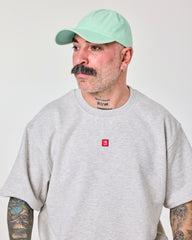 side view of a man wearing Shoreditch Light Green Washed Cap