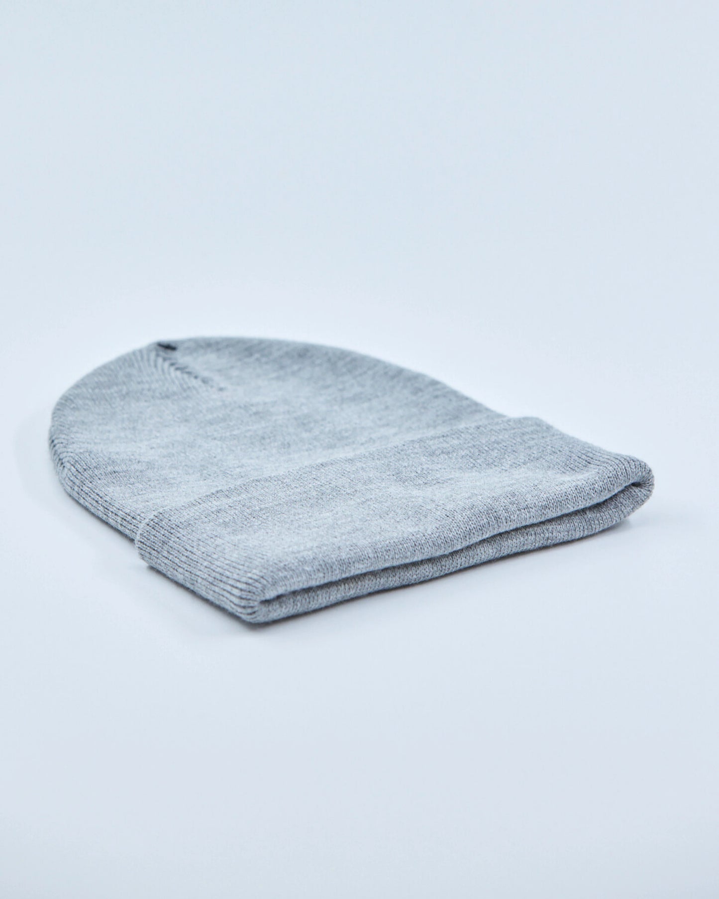 Gray knit beanie on a light gray background