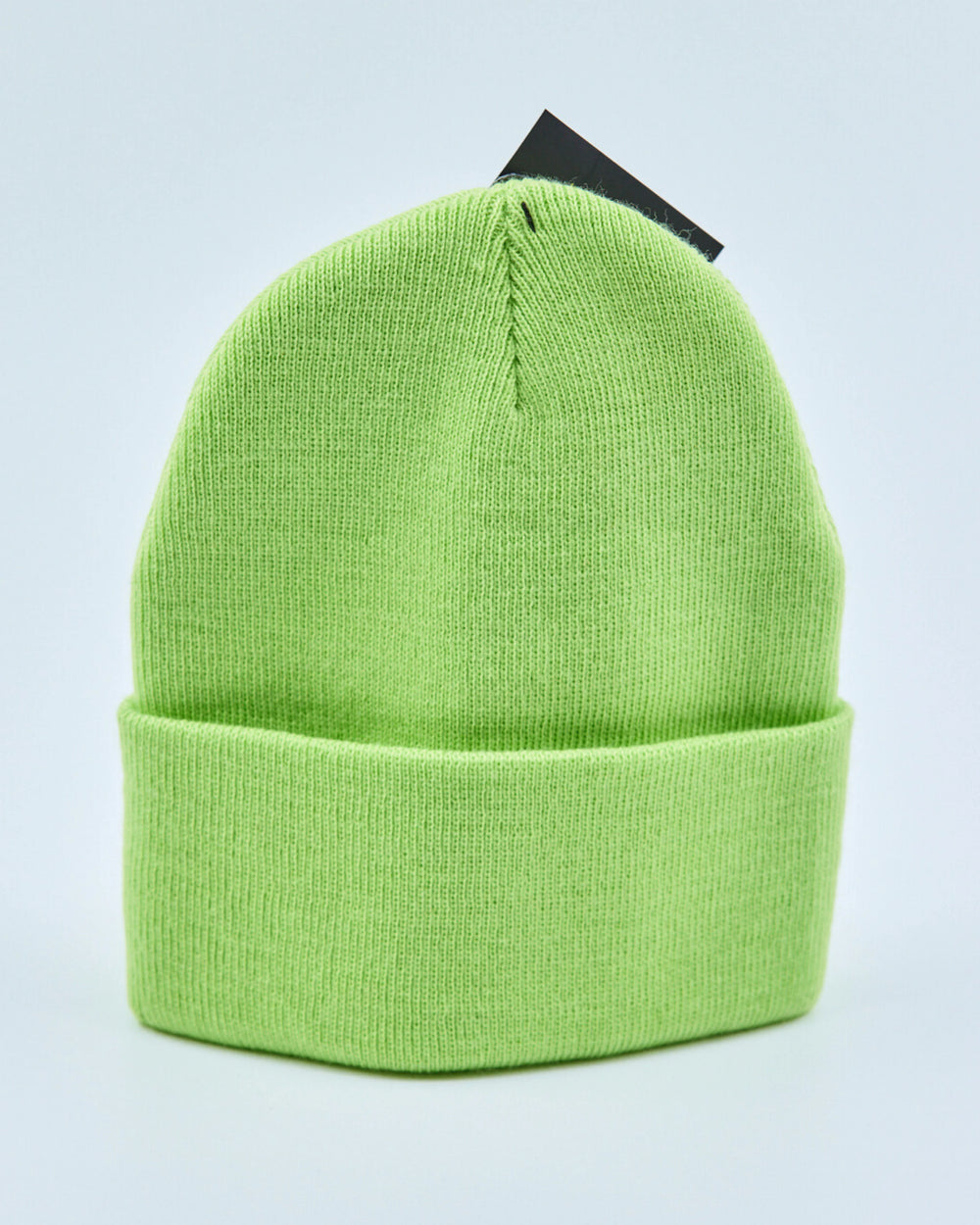 Light lime green beanie on a light gray background