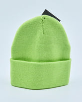 Light lime green beanie on a light gray background