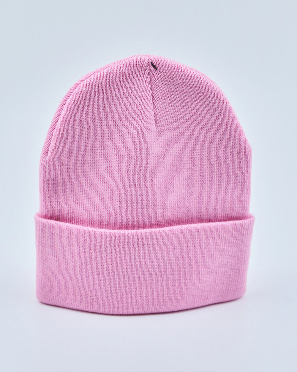 Light pink beanie on a light gray background