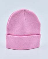 Light pink beanie on a light gray background