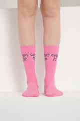front view of pink cute but psycho socks
