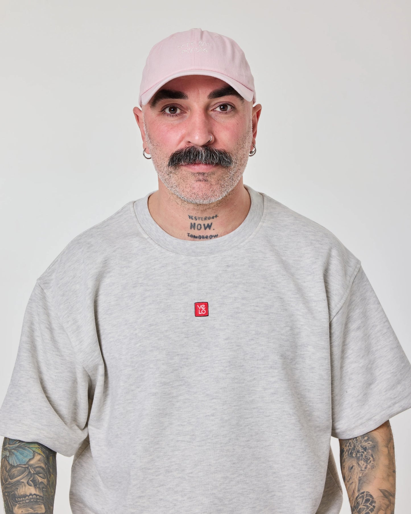 front view of man wearing Cute But Psycho Light Pink Washed Cap