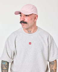 side view of man wearing Cute But Psycho Light Pink Washed Cap
