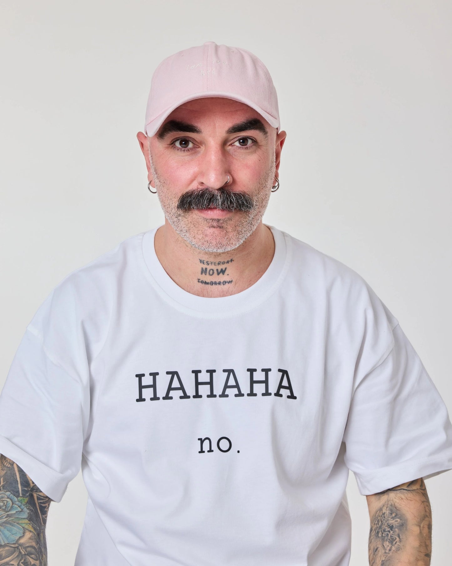 man wearing Light Pink Washed Cap with Love You Bye embroidered in white