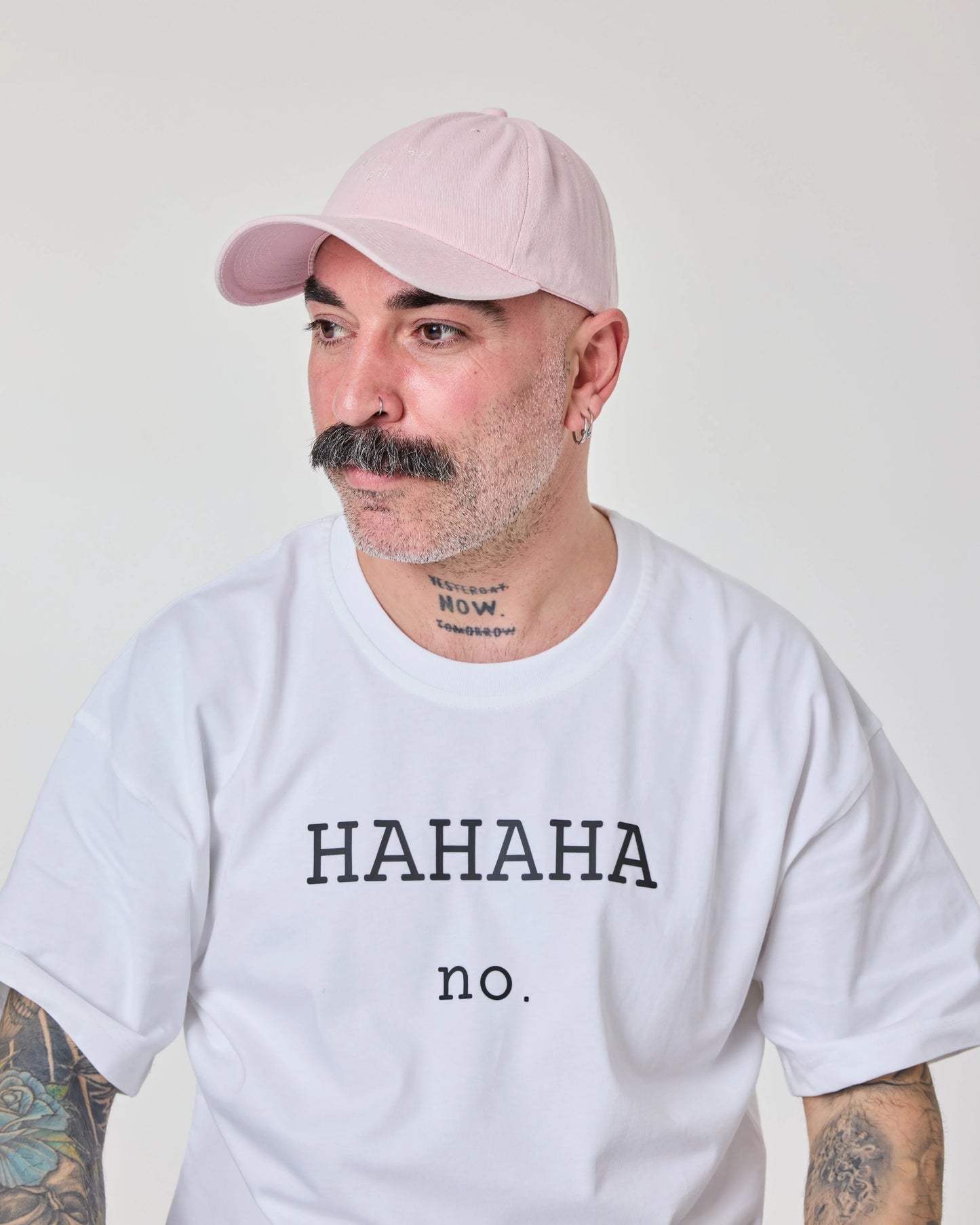 man wearing Light Pink Washed Cap with Love You Bye embroidered in white