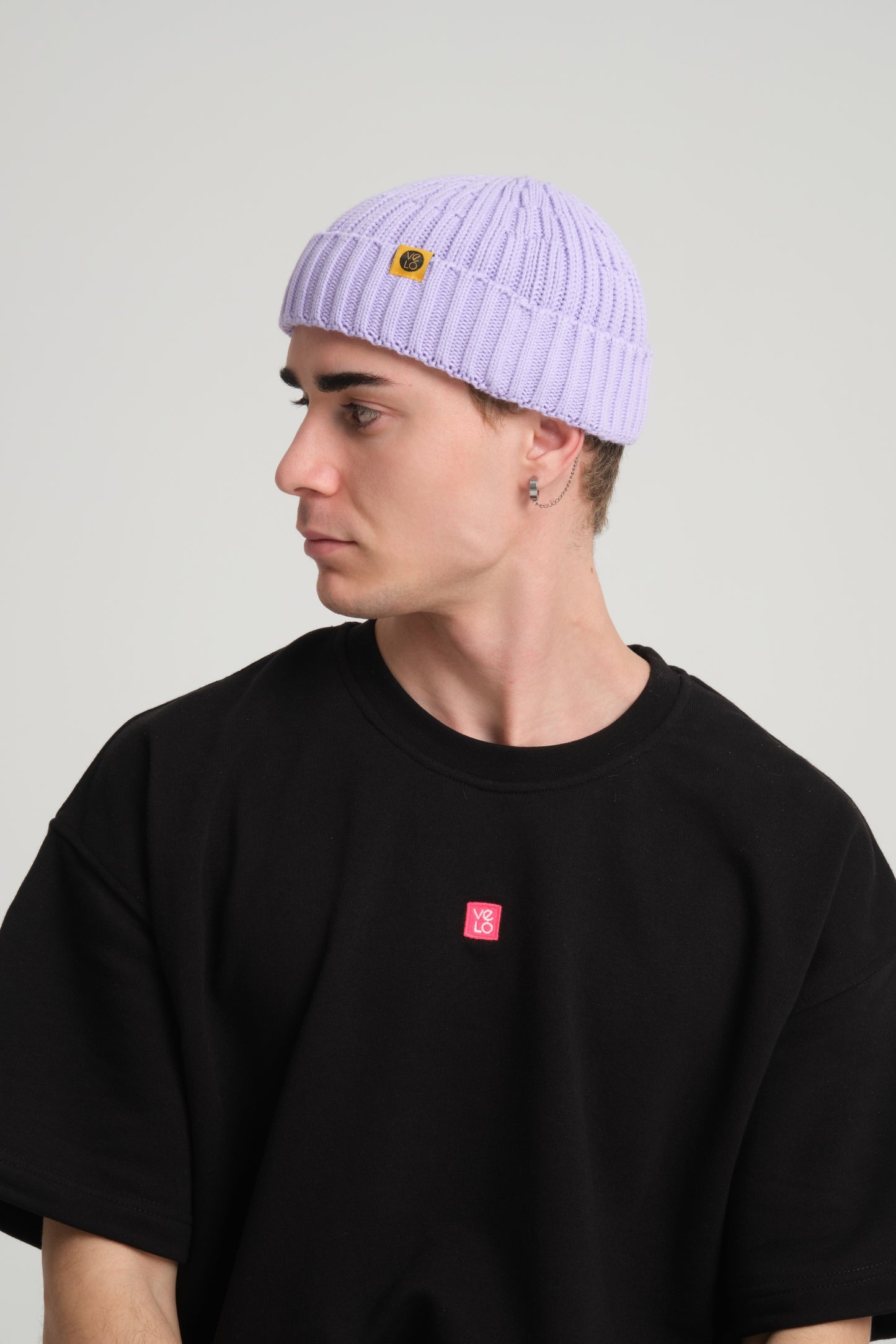 side view of a man wearing Lilac Fisherman Beanie