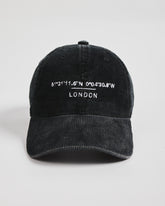 Black cap with white text on a light gray background