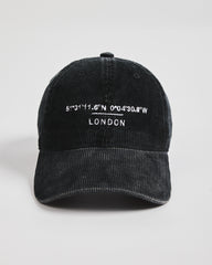 Black cap with white text on a light gray background