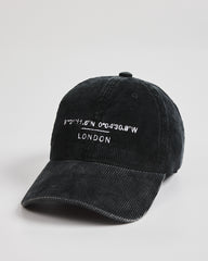 Black cap with white text on a light gray background