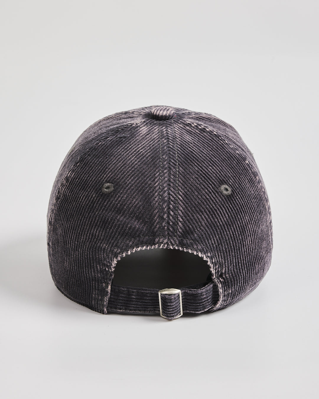 Charcoal grey distressed baseball cap on a light gray background