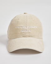 Cream cap with text on a light gray background