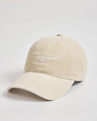 Cream corduroy cap on a light gray background